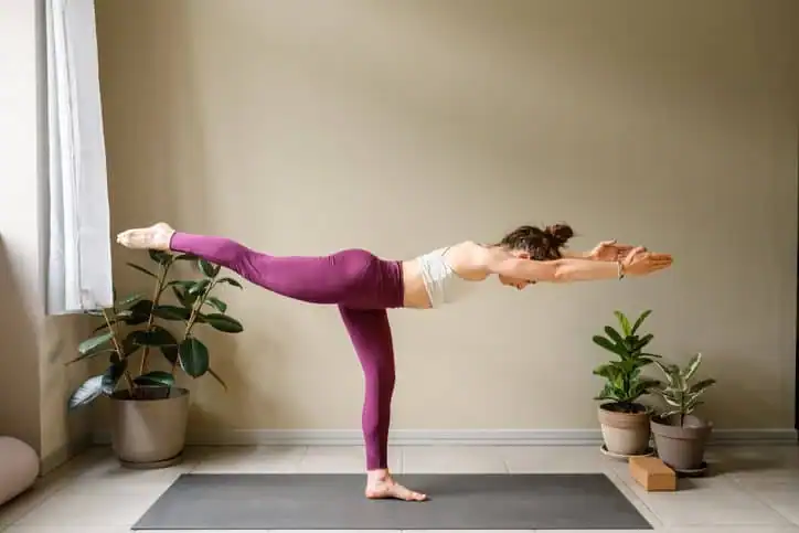 Achieving the Perfect Tone: How Often Should You Exercise for Results? 1 Woman doing Yoga exercise Sutton Coldfield to help with toning the body.
