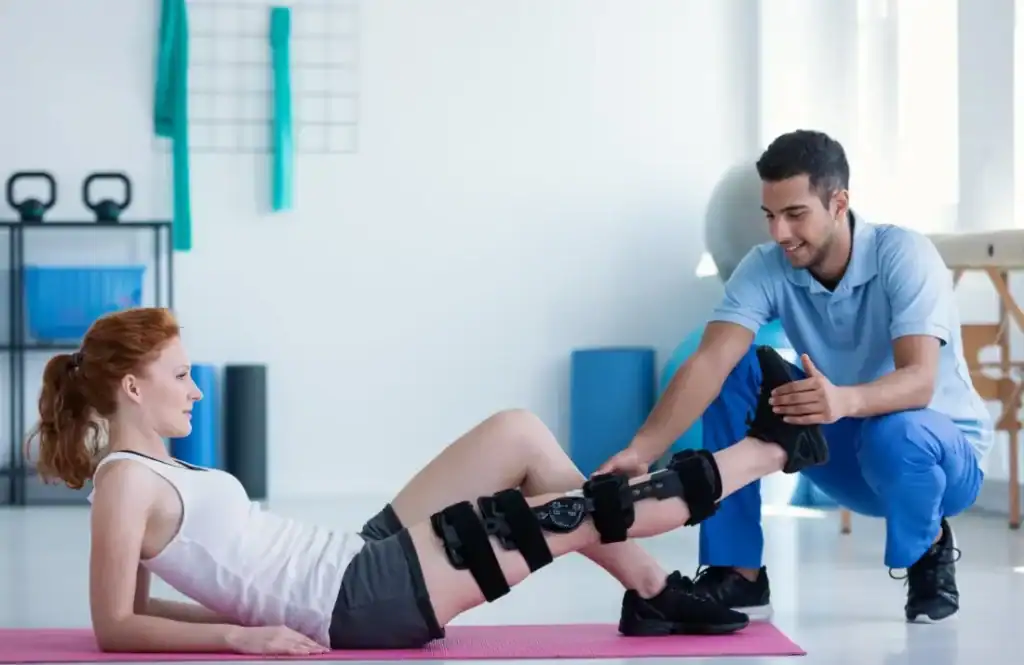 Debunking Meal Timing Myths: The Truth About Muscle Recovery 1 Woman having treatment to help muscle recovery Sutton Coldfield after an injury