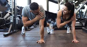 Sculpting Sleek Arms: The Essential Role of Cardio in Toning Without Bulking Up 1 Image of man and woman doing Cardio Sutton Coldfield to tone their arms.